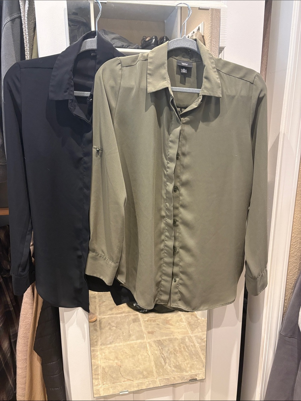 Bundle of 2 women’s small and medium dress button up shirts